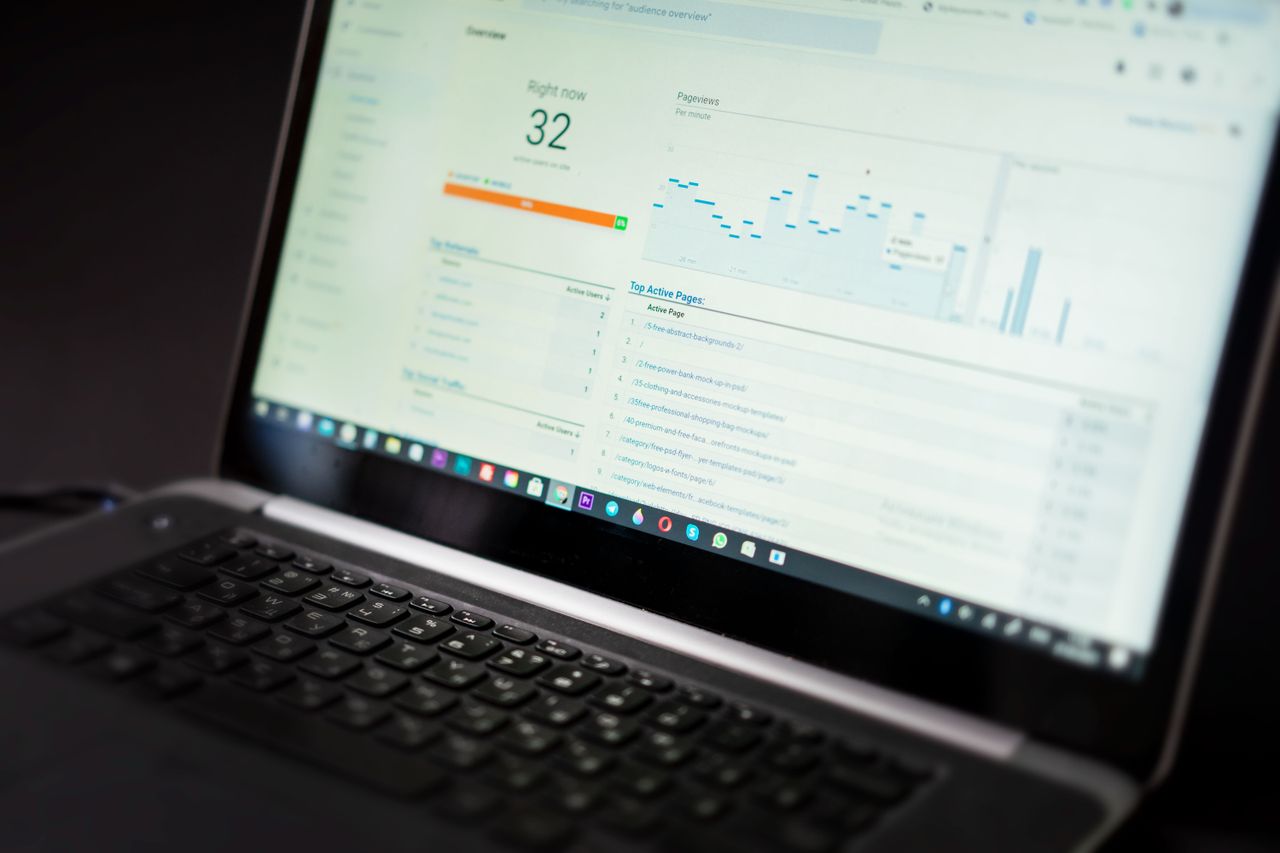 creative A laptop displaying an analytics dashboard with real-time data tracking and analysis tools.